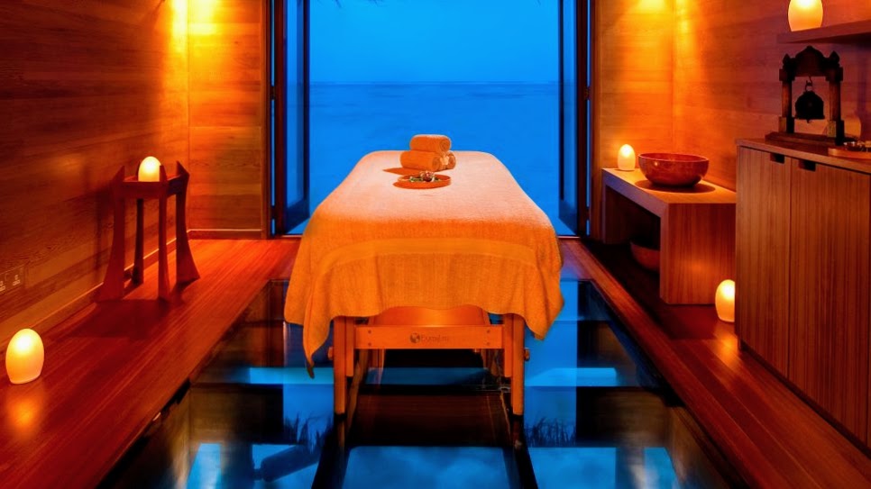 Treatment rooms at The Over-Water Spa have glass floors so guests can watch fish swim past below them during the treatment, Conrad Maldives Rangali Island